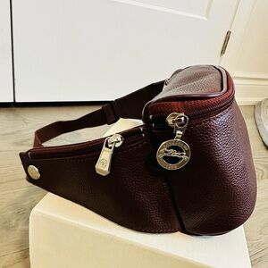 Authentic Longchamp waist belt bag in Burgundy colour . Excellent condition